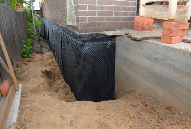 Happy homeowners after waterproofing job in Gwynn Oak